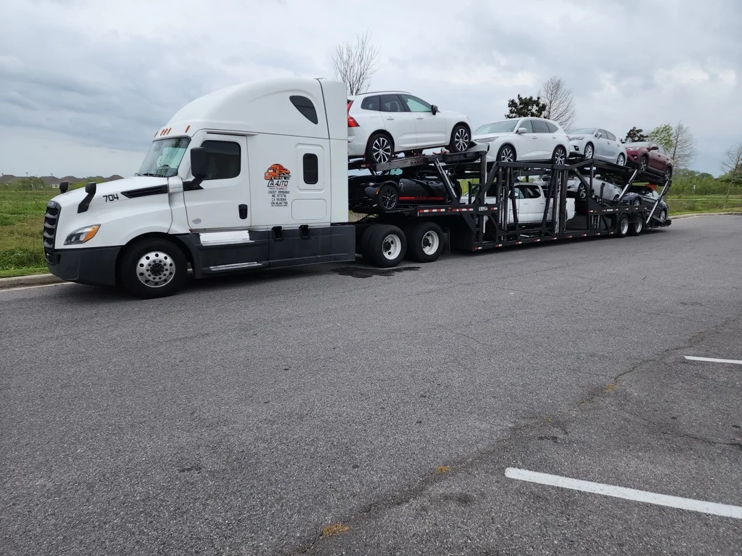 CA Auto Express carrier truck transporting vehicles across the country